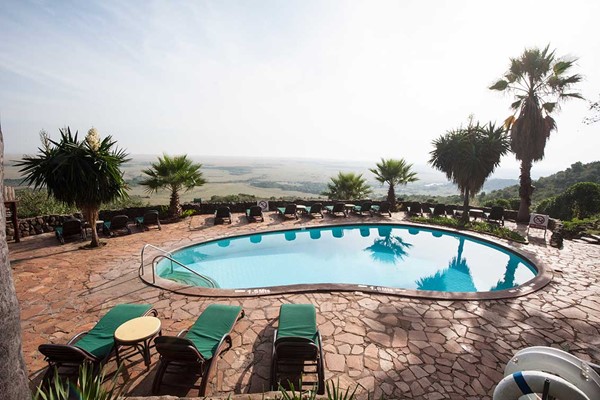 luxury safari in masai mara beautiful pool at safari mara serena lodge with beautiful view #6 ©bushtreksafaris