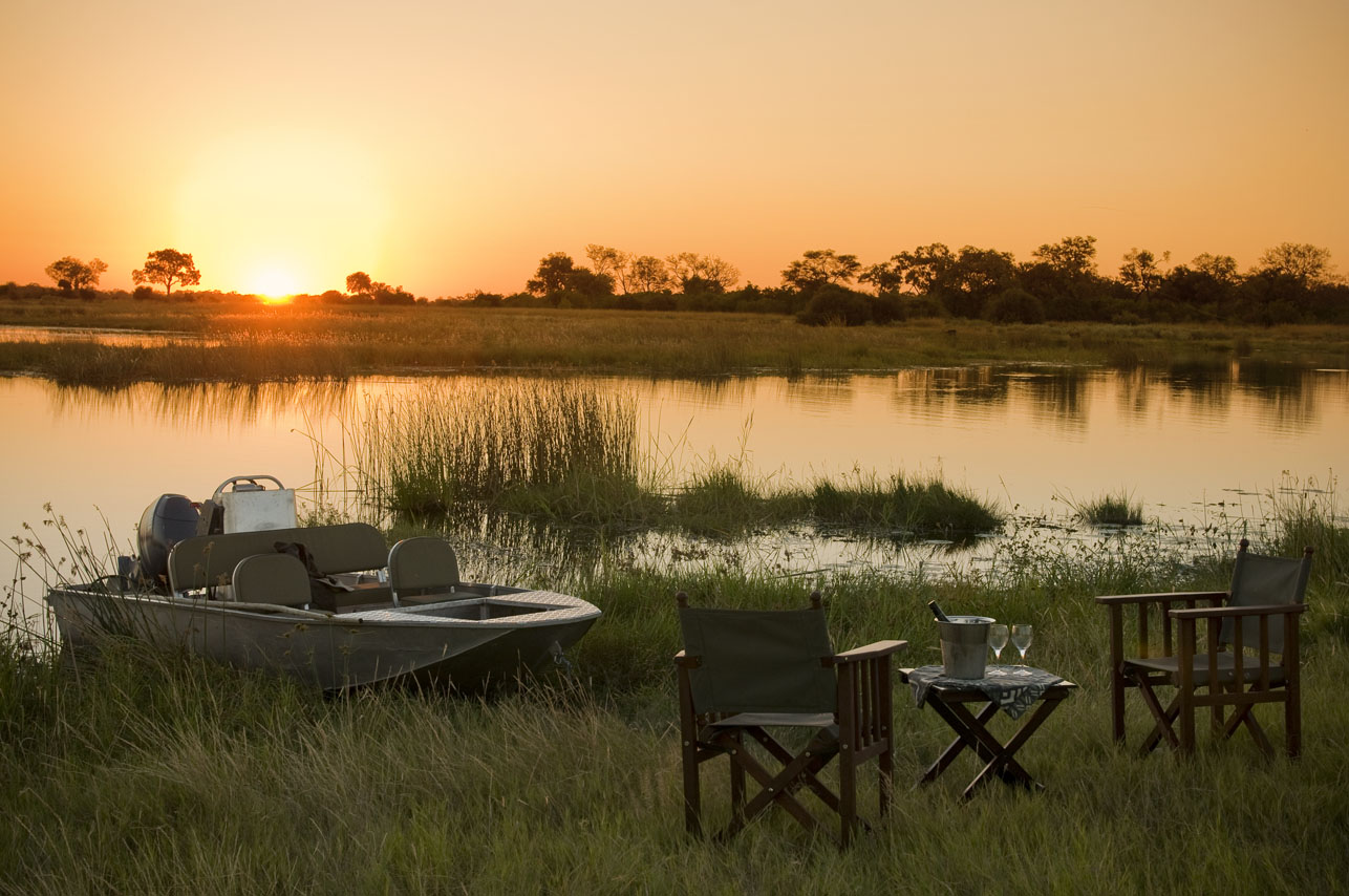 Boat And Drinks At Sunset on safari in Africa ®bushtreksafaris