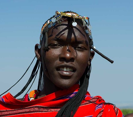 maasai warrior head shot with head ornaments worn ®bushtreksafaris