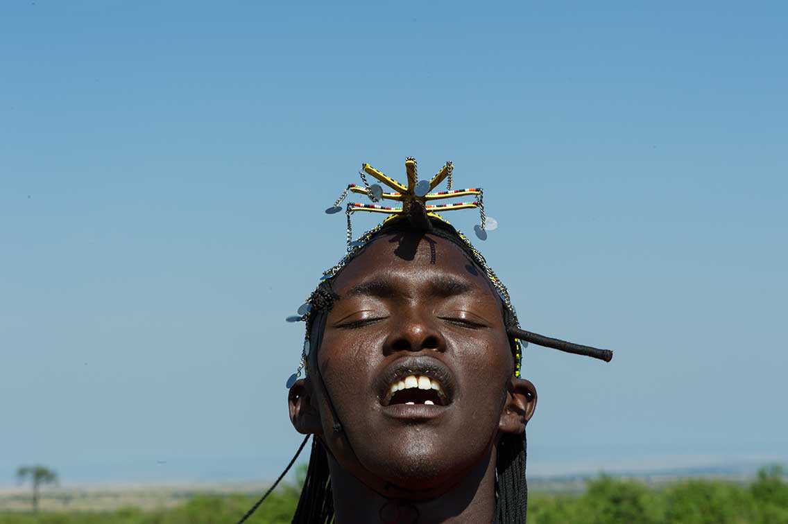 head shot of jumping maasai warrior ®bushtreksafaris