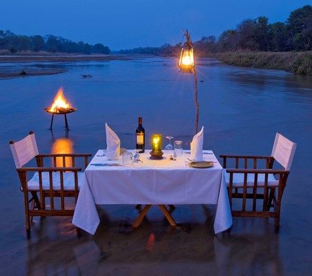 bush dinner for two on shallow water flats on honeymoon safari ®bushtreksafaris