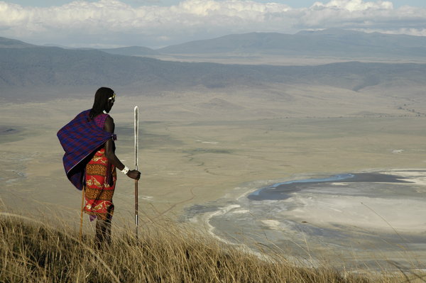 Ngorongoro crater rim with Maasai looking into crater basin dry season