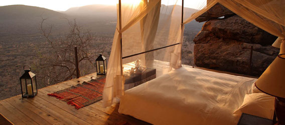 view from luxury lodge bed deck overlooking samburu plains safari