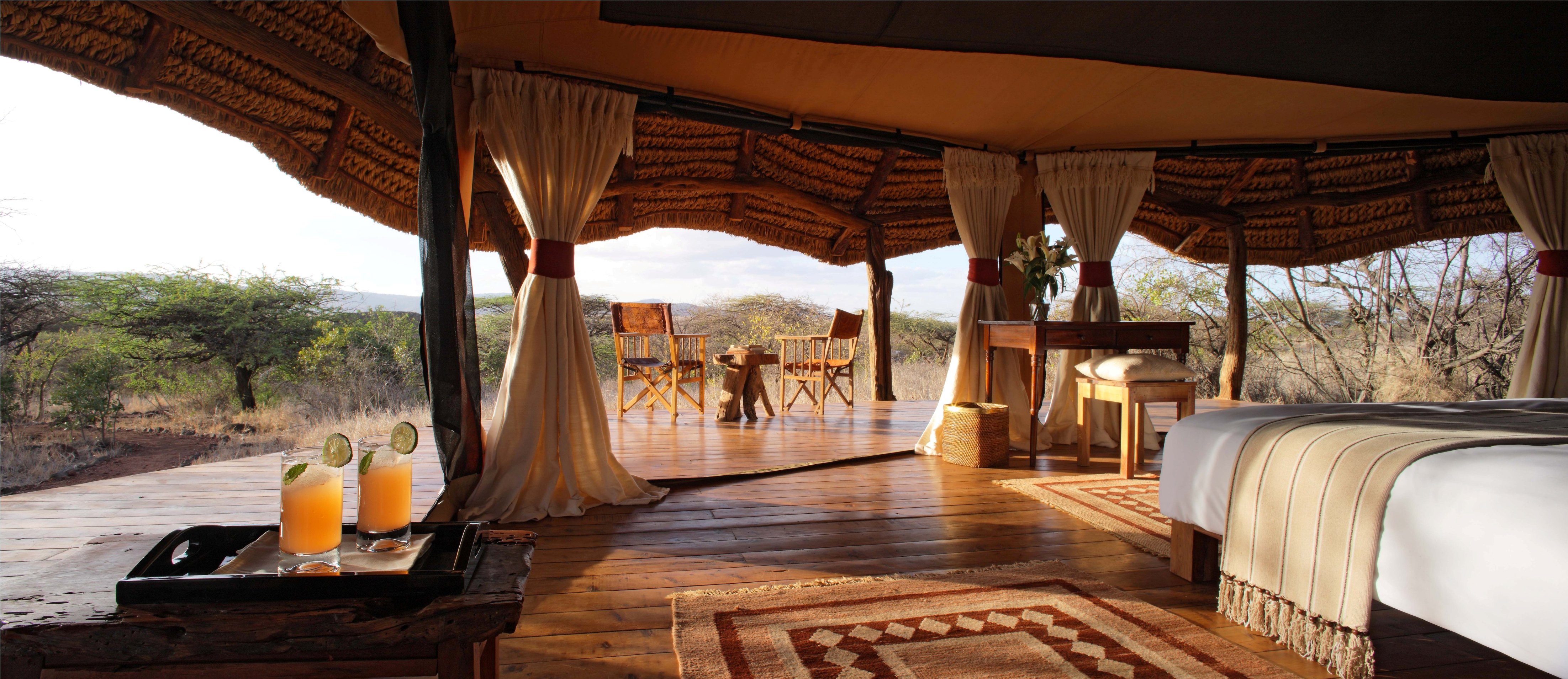 Lewa Safari Camp Tent Interior photo showing spectacular setting and view luxury conservancy safari