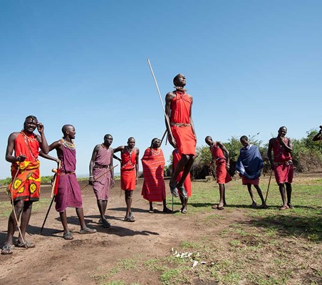group of maasai warriors jump meet the maasai on your safari to Kenya #5 ®bushtreksafaris
